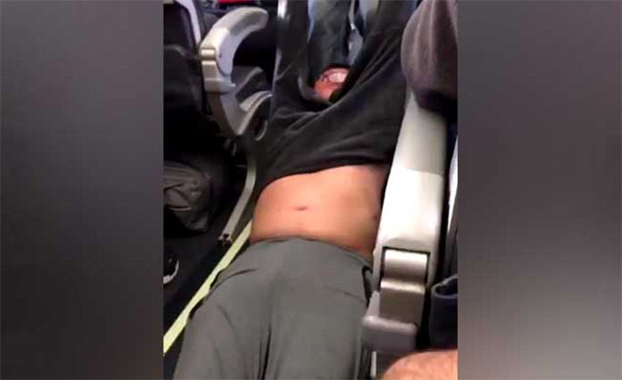 United Airlines Drags Passenger Off An Overbooked Flight